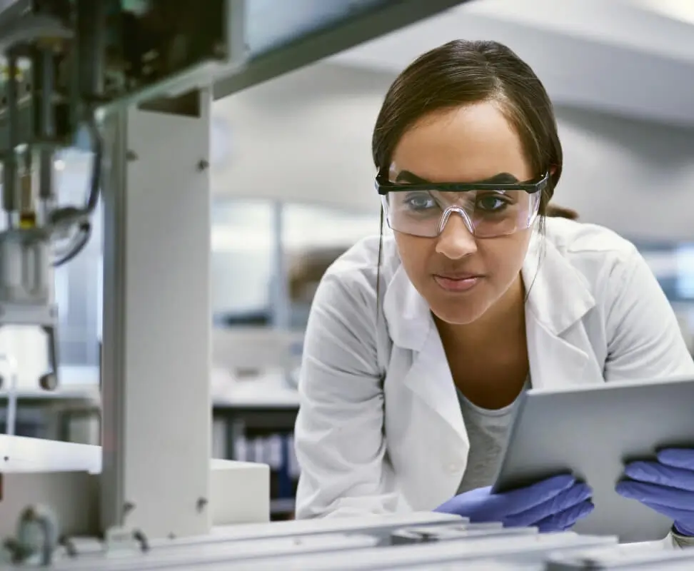 Scientist checking test-metrics on a Tablet