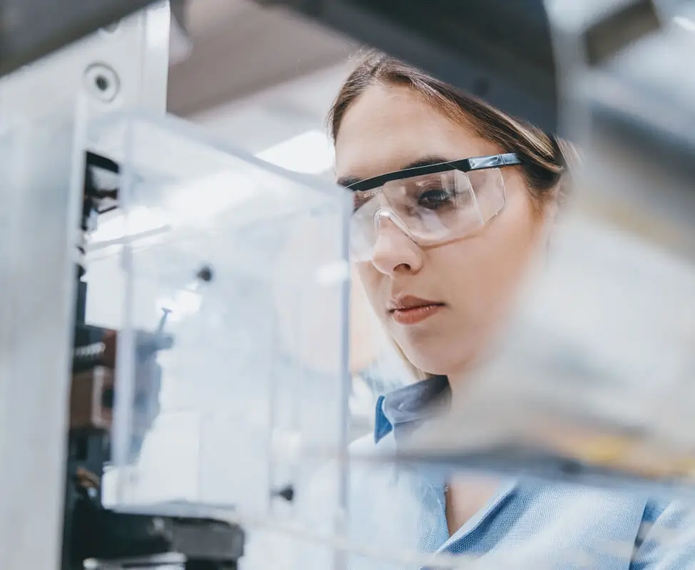 Female scientist examining Sterilizaiton equipment