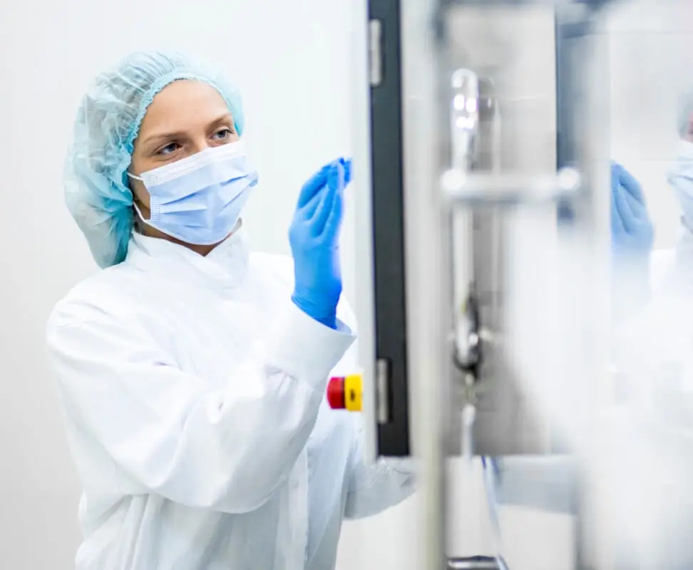 Female scientist interfacing with Infinity Cleanroom equipment